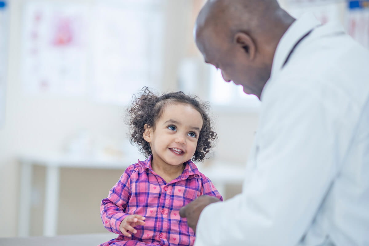 Pediatric gastroenterologist at Studer Family Children’s Hospital in Pensacola, Florida, talking with a child.