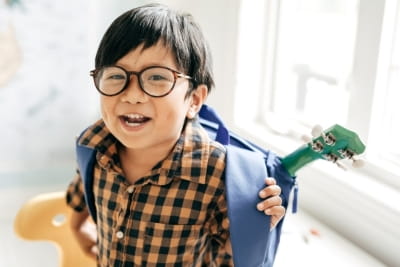 Young boy wearing glasses.