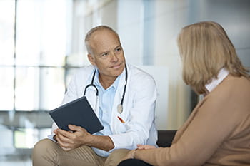 Doctor talking with a patient.
