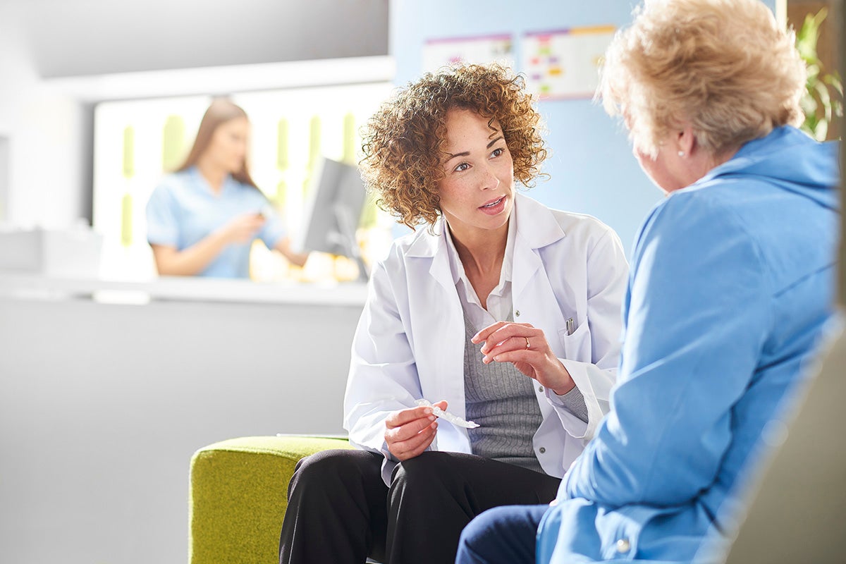 Ascension doctor discussing care with a patient during a visit.