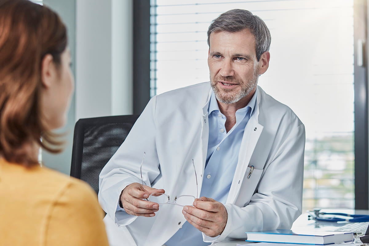 Doctor talking with patient about resources available at Ascension Texas Brain and Spine Institute in Austin, Texas.