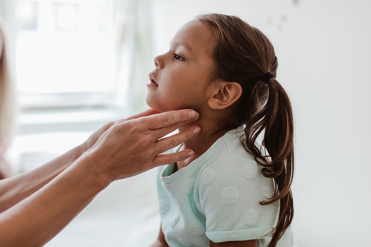 Child with pediatric voice disorder getting care from a speech therapist (also known as a speech language pathologist) at Dell Children’s Medical Center in Austin, Texas.