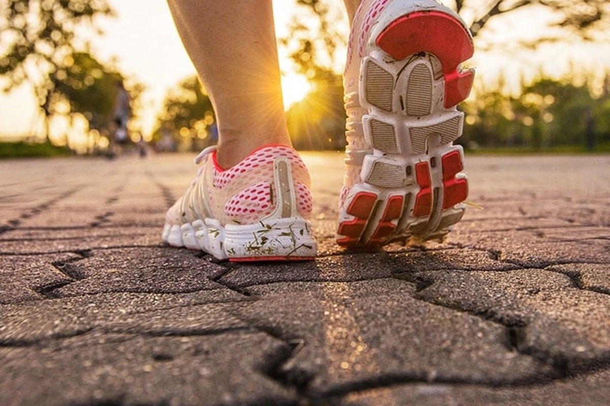 Person walking outdoors in athletic shoes