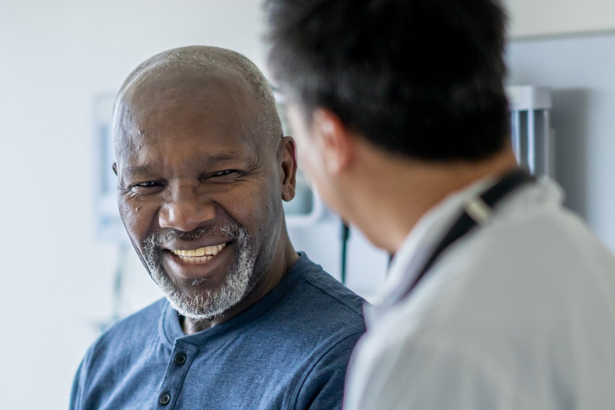 Male doctor talking to a male patient