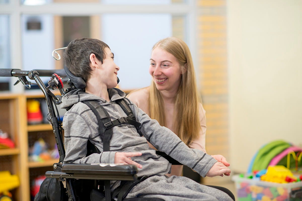 Volunteer working with a patient at Peyton Manning Children’s Hospital.