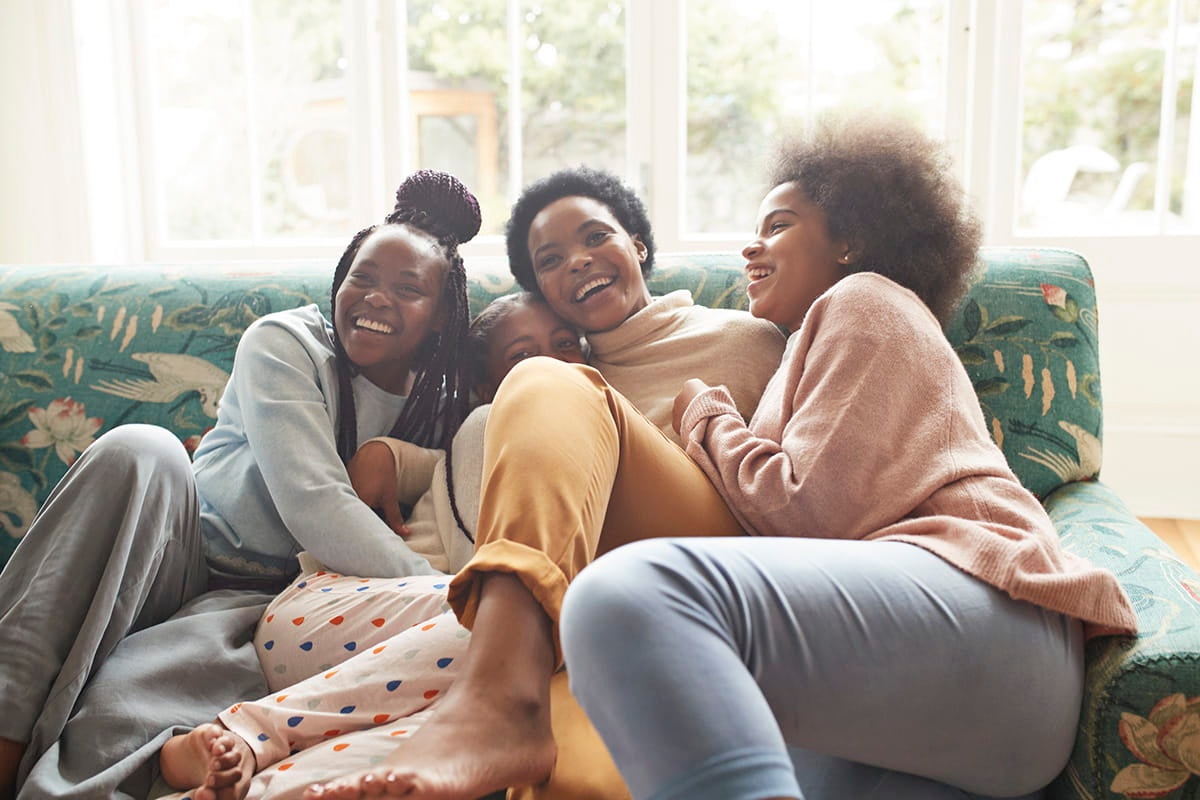 Mom and daughters laughing together after receiving the support they needed from Ascension Medical Group Seton Women's Health Davis Lane.