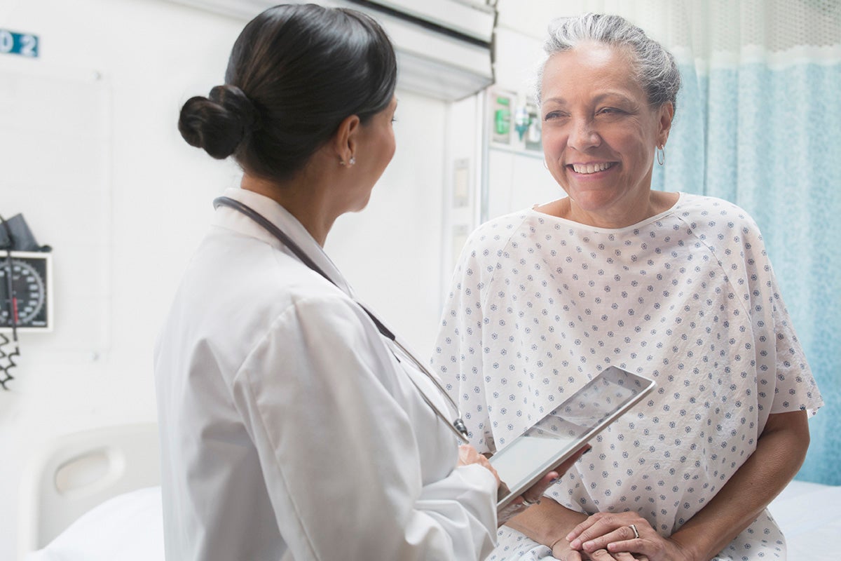 Female patient being comforted by her nurse before a procedure at Ascension Medical Group Providence Women's Health in Waco, TX.