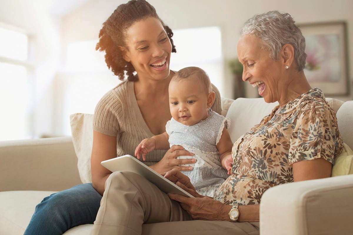 Mother, daughter, and granddaughter discussing women's health care options at Ascension Medical Group Seton Women's Health Davis Lane in Austin, TX.