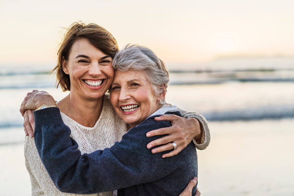 Women hugging; gynecologic oncologists at Ascension St. Vincent’s Cancer Care deliver advanced cancer care for women.