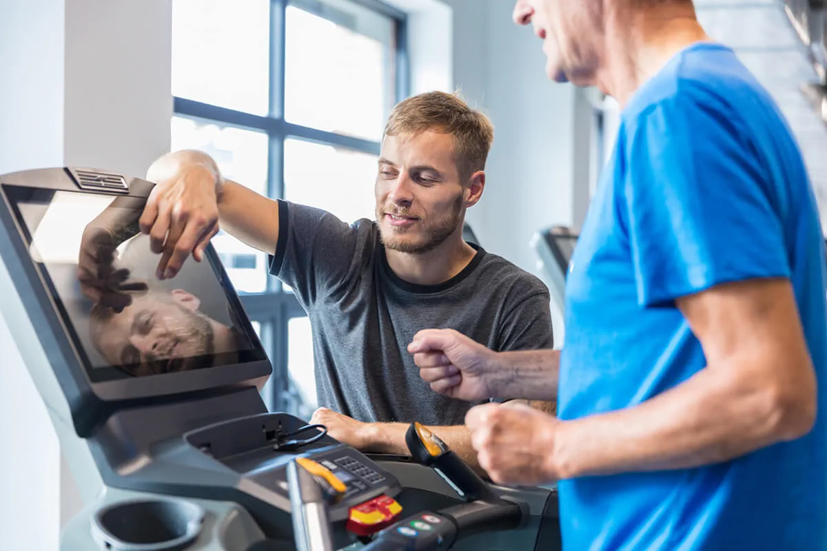 Man getting rehabilitation care from an athletic trainer at an Ascension site of care.