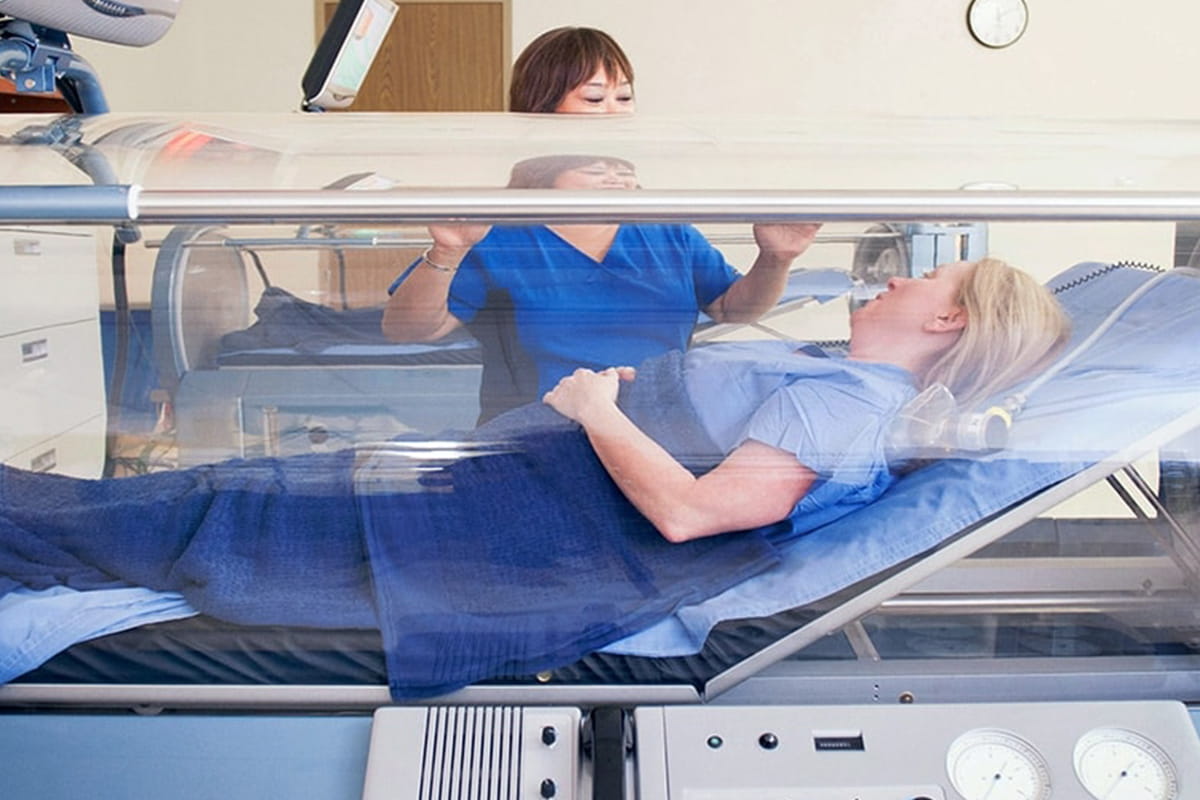 Patient relaxing in a hyperbaric chamber.