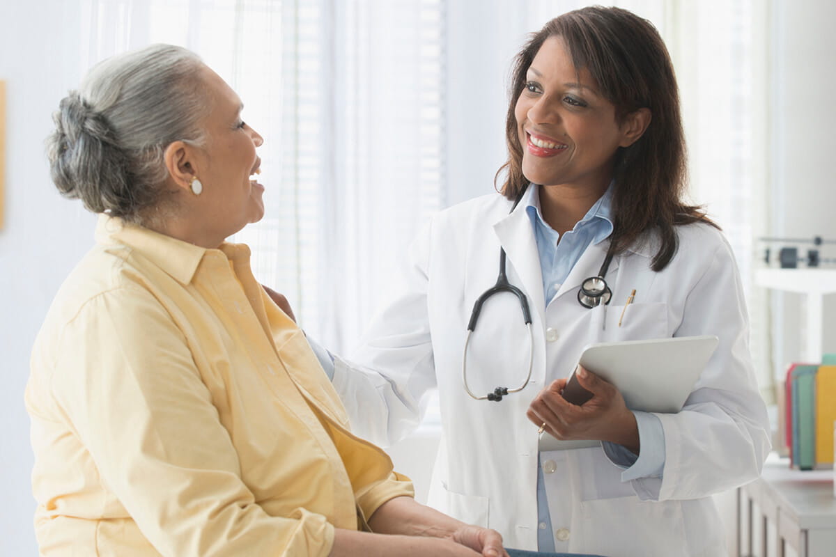 Patient talking to a cancer doctor at an Ascension site of care.