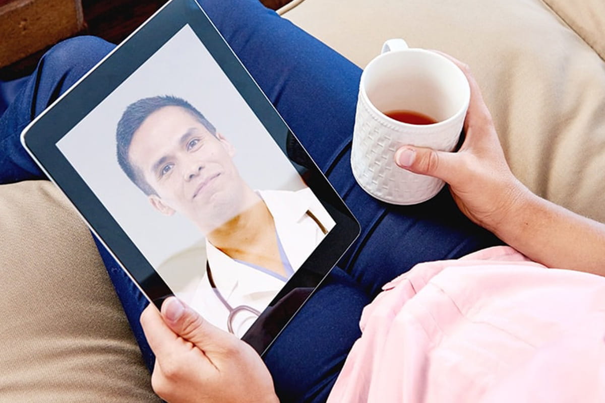 Woman talking to her doctor using video chat on her tablet 