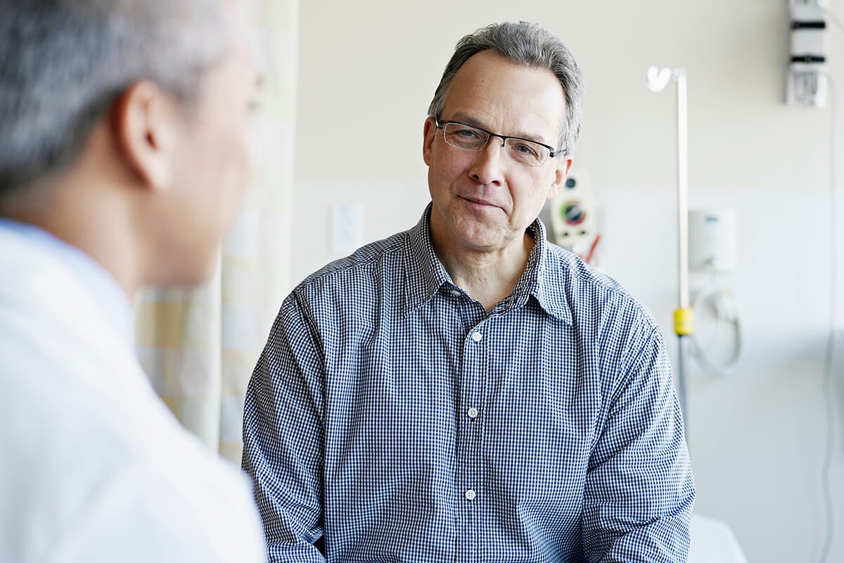 Patient talking with an oncologist at an Ascension site of care.