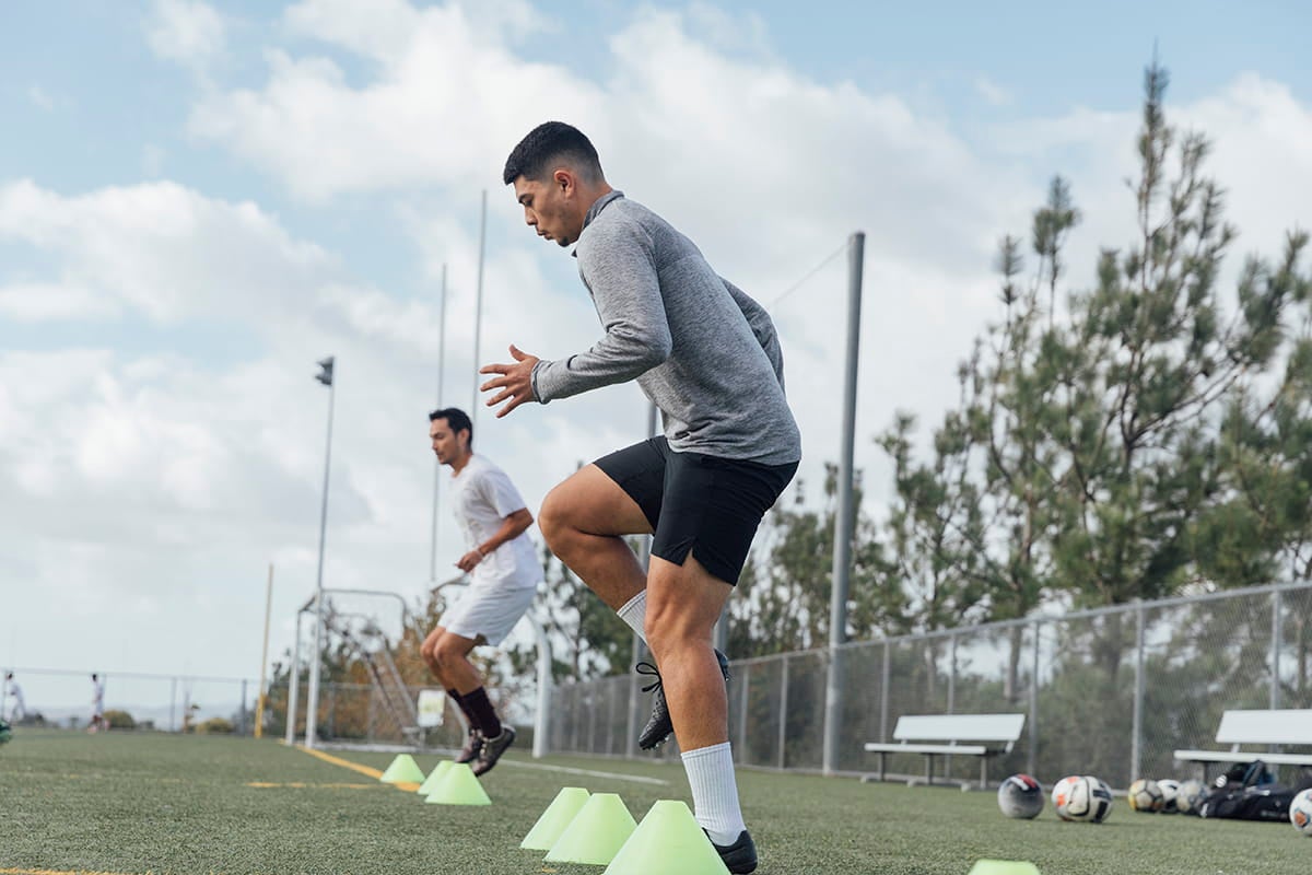 Young man exercising on soccer field.