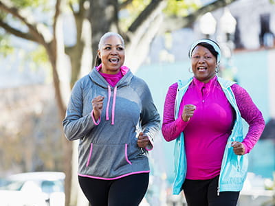 Friends exercise together on their bariatric weight-loss journey.