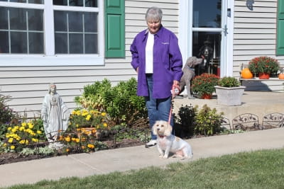 Jean Beck outside with her dog Belle