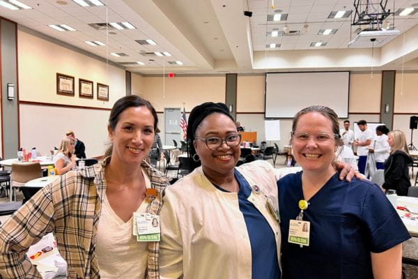 Davisa poses with two other nurses for a picture