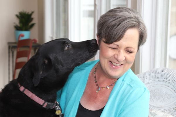 Chicago breast cancer survivor Karen Wilson with her black labrador