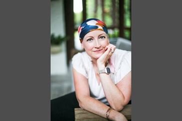 A woman wearing a headscarf and a watch