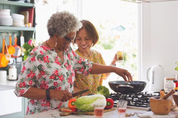Two women cooking a healthy lunch