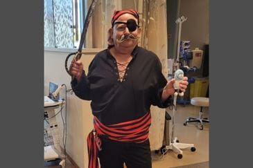 Michael Racine dressed as a pirate while undergoing cancer treatment at Ascension All Saints Cancer Center in Racine