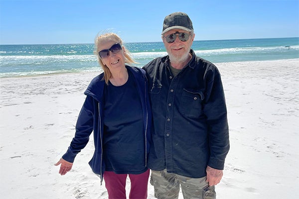 Deborah and her husband enjoy the beach.