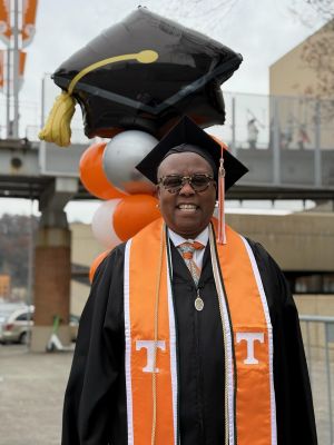 Sharon in graduation gown.