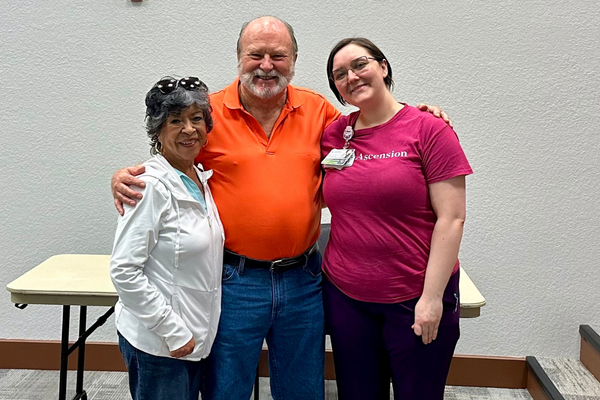 Bruce with his wife (left) and nurse Karma (right)