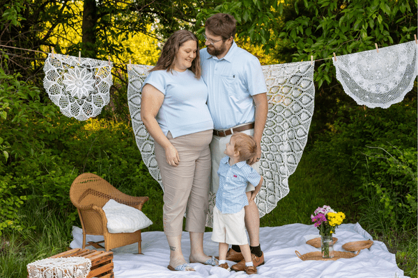 Jonnie and AJ VanKleeck stand with their son, Elias