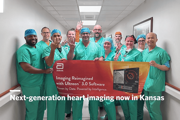 Via Christi’s heart surgery team stands with a banner promoting the Ultreon 3.0 Software. 