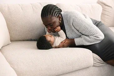 Mom hugging her baby.