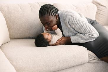 Mom hugging her baby.