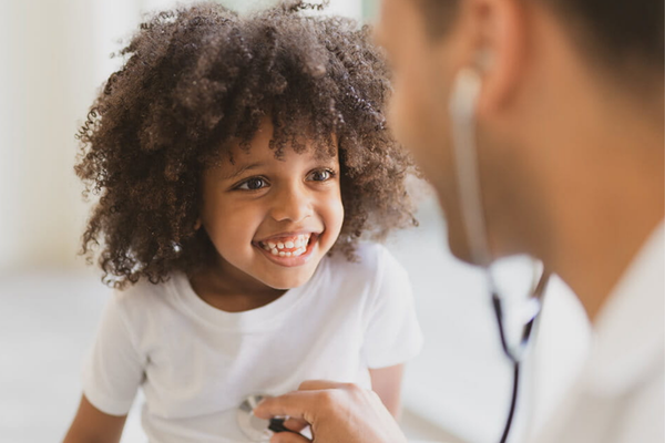 Doctor examining a child.