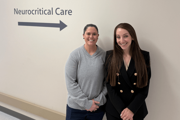 Shahed Toossi, MD, medical director of neurocritical care, and nursing manager Sam Desota posing in the Neurocritical Care Unit at Dell Seton Medical Center at The University of Texas.