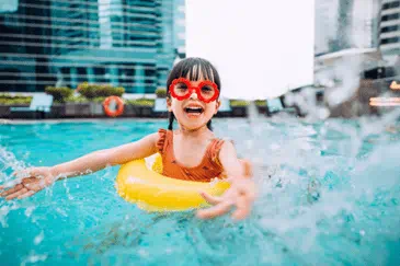 A child enjoying the pool. 