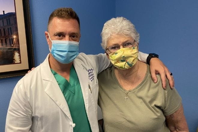 Surgical oncologist Dr. Leo Villegas with pancreatic cancer survivor Marianne Crane