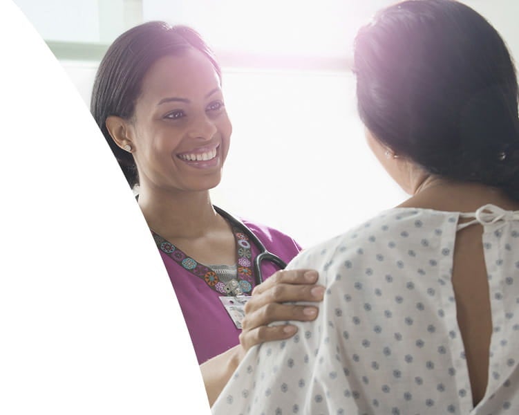 Provider comforting patient before her exam at Ascension Medical Group Seton Women's Health - Williamson.