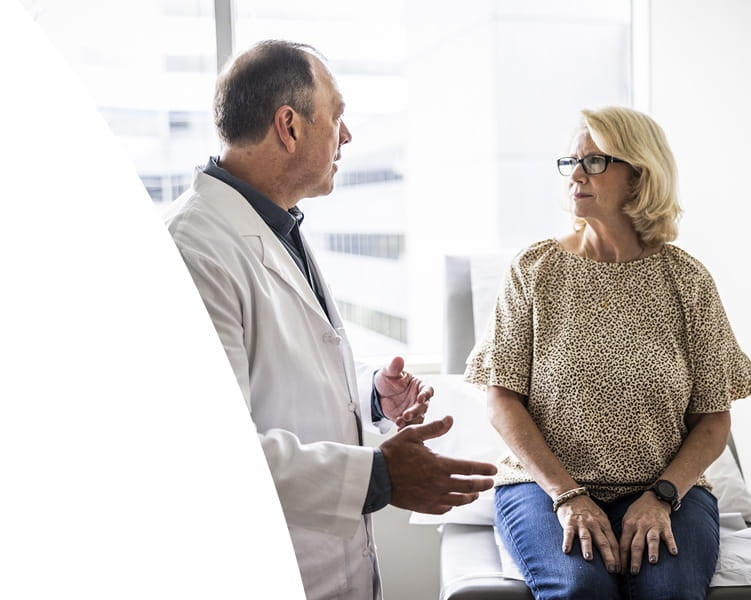 Woman getting care from doctor at Ascension Texas Brain and Spine Institute.