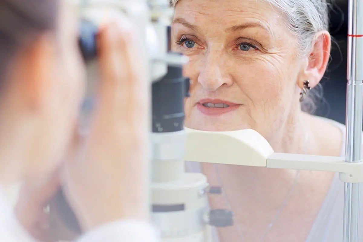 A provider is examining a patient’s eye using an OCT scan