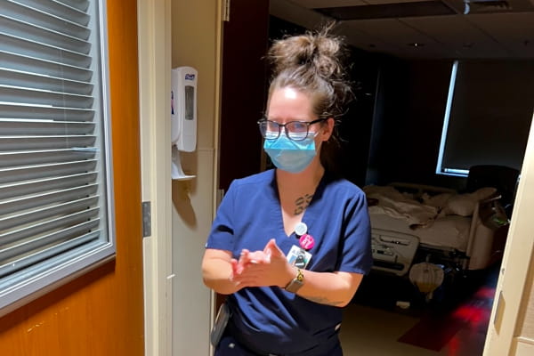 Jessie Tomlinson, medical assistant, sanitizing after leaving a patient room