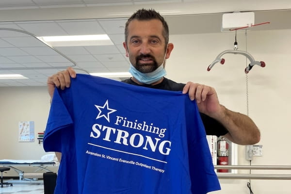 Jimmy Hearvin posing with his "Finishing Strong" shirt from Ascension St. Vincent Evansville Occupational Therapy.