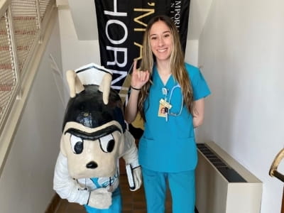 Tania Allen with Emporia State University mascot.