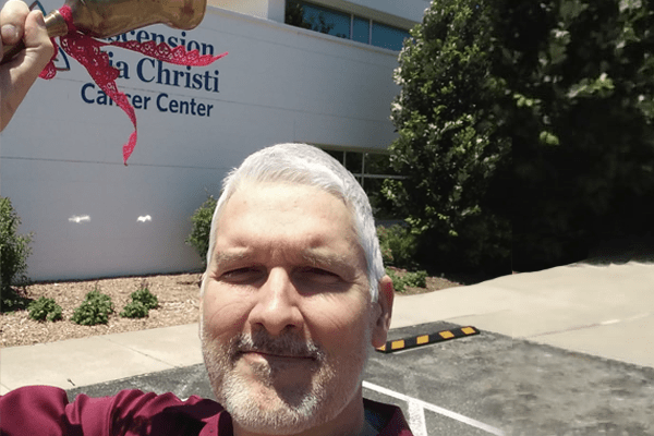 Paul Klusman leaving his last cancer treatment appointment