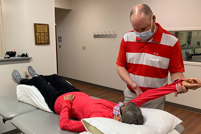 Beth Gorman receives physical therapy training from Ryan Niederklein at Ascension Via Christi Therapy Center in Pittsburg, Kansas. 