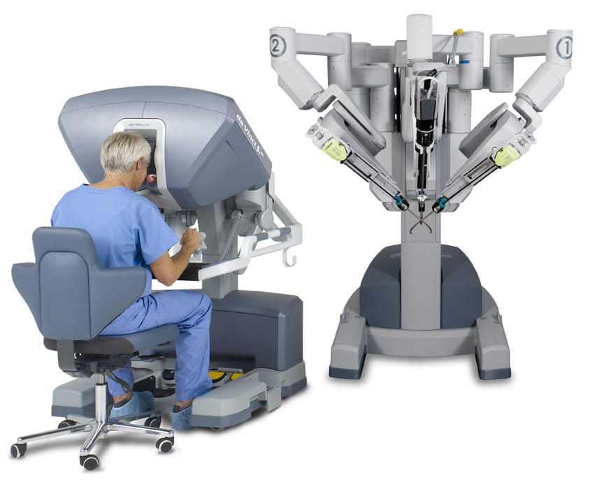 Surgeons work at daVinci robotic console 