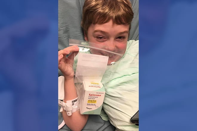 Karsten Price, 9, pictured with Spinraza, the first treatment approved by the Food and Drug Administration to treat spinal muscular atrophy (SMA), a rare neuromuscular disorder that affects the motor nerve cells in the spinal cord. Karsten is the first pediatric patient in the region to receive this treatment.