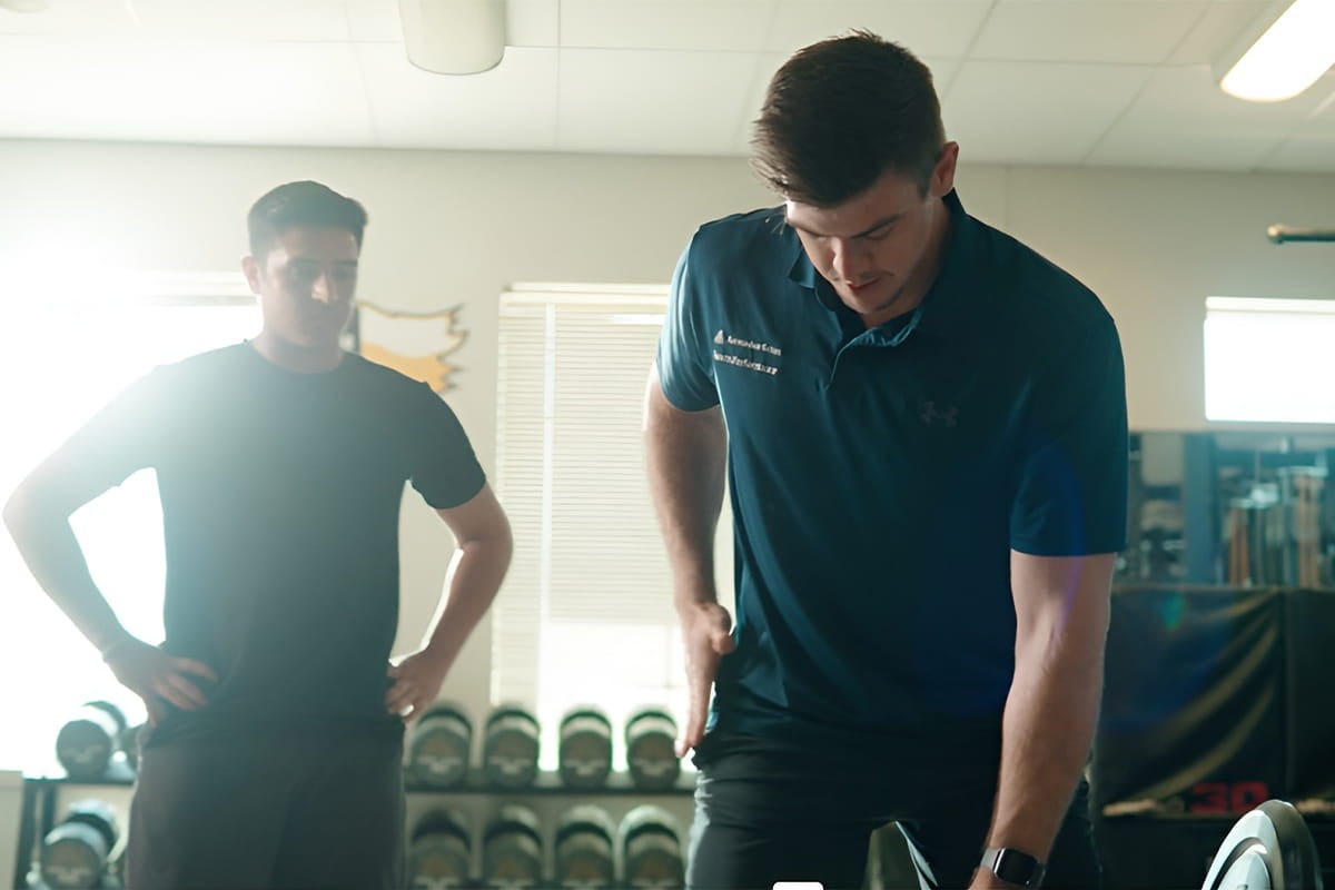 A patient receiving physical therapy care to help with his arm strength.