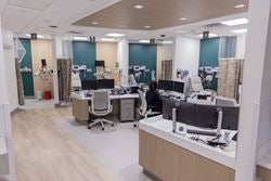 Emergency department treatment bays surrounding a central nurses station at Ascension St. Vincent’s Southside.