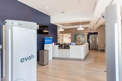 Emergency department entrance and reception area with Evolv security screening equipment.